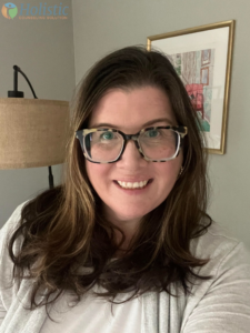 Courtney Henson, a Licensed Clinical Social Worker in New Jersey specializing in CBT and ACT for adults navigating life transitions at Holistic Counseling Solution.